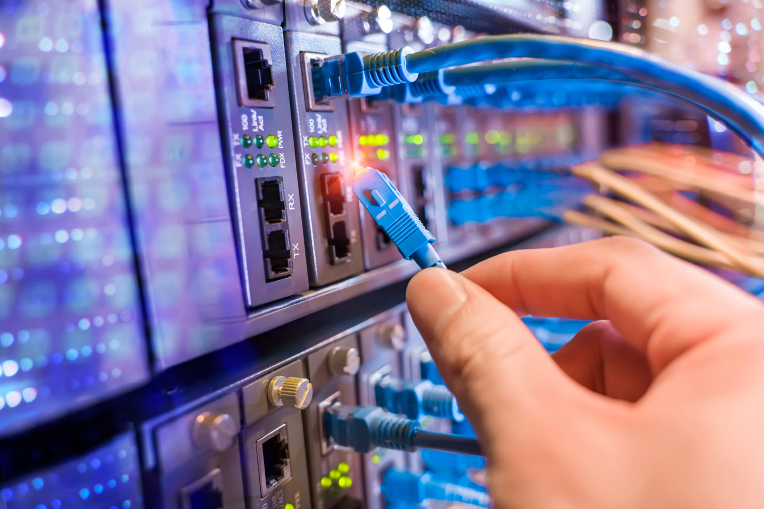 hand plugging in network cable